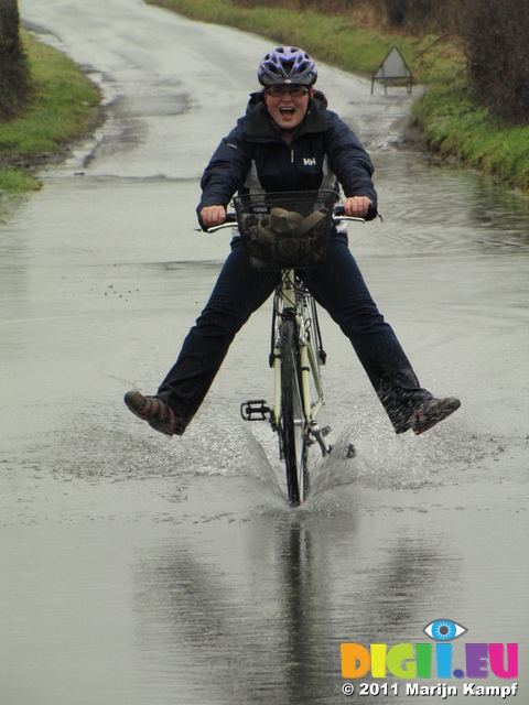 SX17154 Jenni cycling through flooded road